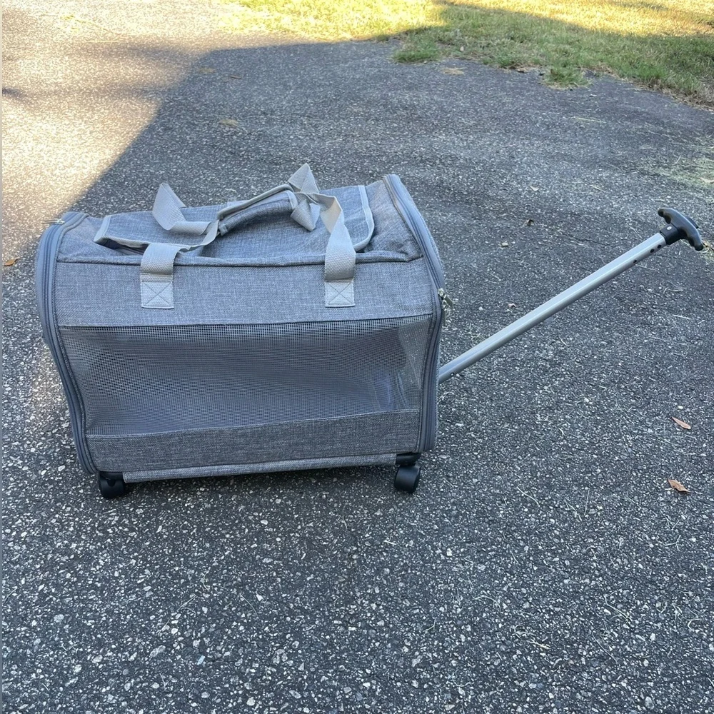 A pet travel carrier and roller. 2 doors on each side. Detachable roller base.